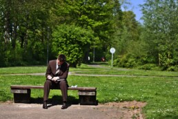 business man sitting on bench