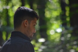 refugee man in forest