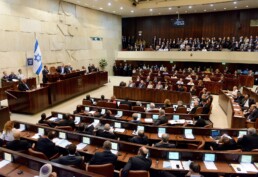 Politicians in Israel's legislative assembly discuss and debate, but the Israeli Prime Minister Benjamin Netanyahu has frozen a proposed plan to resettle thousands of African migrants living in Israel.