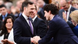 Morneau and Trudeau shake hands