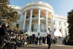 President Donald Trump stands in front of the media outside the White House