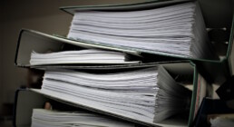 Stacks of documents in binders